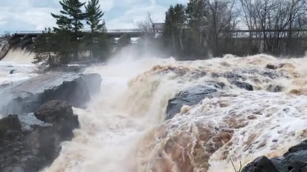 High Spring Floodwaters Surround Local Dam — Stock Video