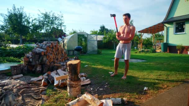 Shirtless Man Uses Axe Break Wood Wide Shot — Wideo stockowe