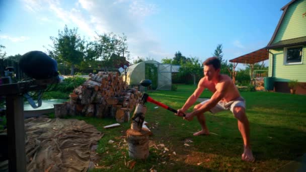 Portrait Young Man Chopping Wood Backyard Summer Wide — 비디오