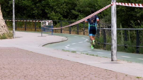 Three Runners Running Marathon Narrow Path Next Some Trees — Stockvideo