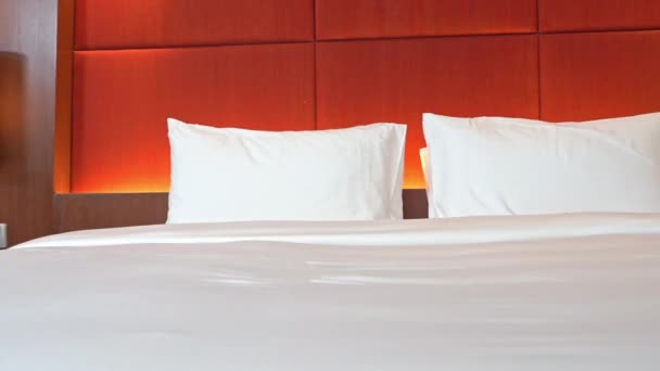 Close Pan Luxurious Hotel Bed Dramatically Lit Headboard — Stockvideo