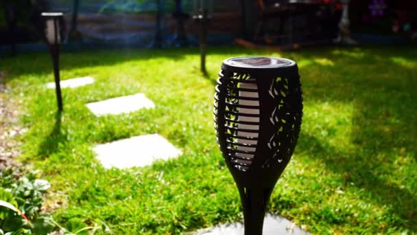 Solar Powered Stylish Modern Torch Lighting Sunlit Garden Lawn Grass — Stock video