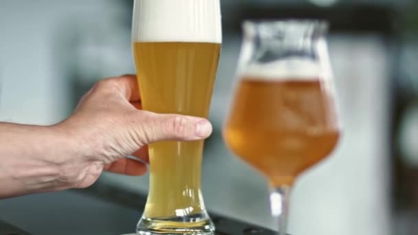 Putting Glass Cold Beer Table Close — Vídeo de stock