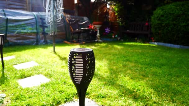 Solar Powered Modern Stylish Torch Lighting Sunlit Garden Lawn Grass — Stock Video