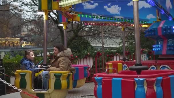 Young Boy Girl Having Fun Riding Fairground Attraction Edinburgh Christmas — Stock video