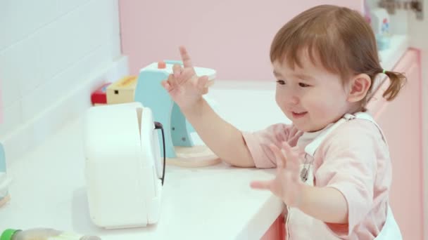 Cute Female Child Enjoys Playing Miniature Toys Toddler Cafe Playroom — Stockvideo