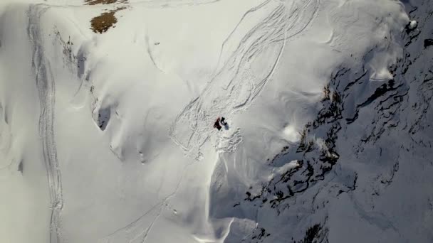 Bottom Drone Shot Snowboarder Snowy Mountain Top Switzerland — Stockvideo