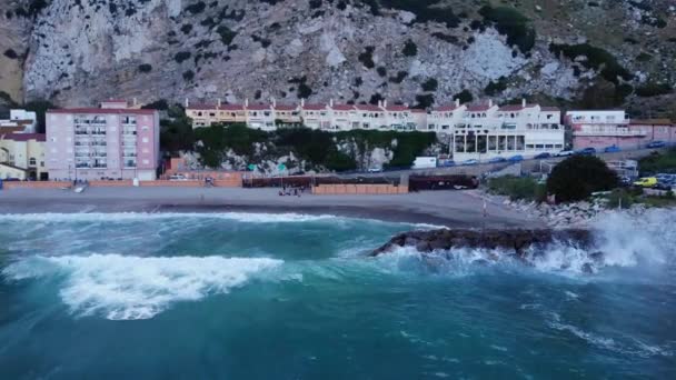 Crashing Waves Sea Walls Catalan Bay Gibraltar Aerial Sideways Shot — стокове відео