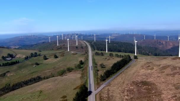 Drone Shot Traveling Forward Road Passing Wind Turbine Park Mountains — 비디오