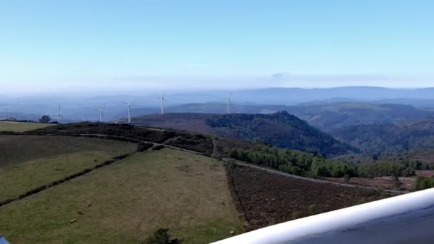 Flying Wind Turbine Idyllic Mountainous Setting Cattle Grazing Sunny Clear — Stok Video