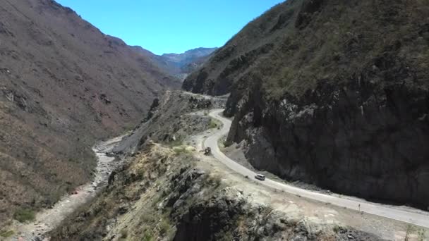White Car Driving Winding Mountain Road Wide Aerial Tracking Shot — Video