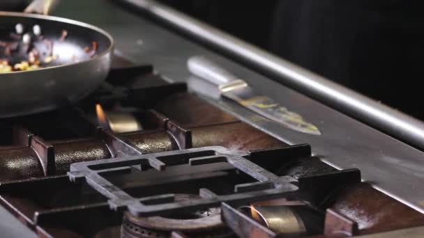 Chef Places Suddenly Nicely Golden Brown Metal Pan Gas Stove — Video Stock