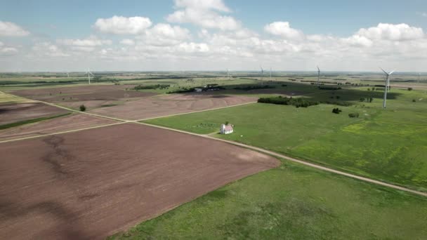 Aerial Approach Small Church Sunny Field Wind Turbines Turning Background — Video Stock