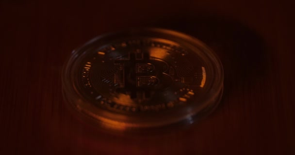 Dim Light Shine Revealing Golden Bitcoin Surface Close — Video