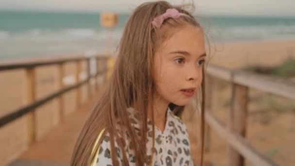 Curious Little Girl Playing Looking Someone Deck Beach Cloudy Day — Vídeos de Stock