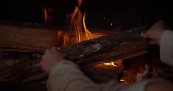 Close Gimbal Shot Womans Hands Putting Firewood Fireplace — Stock video