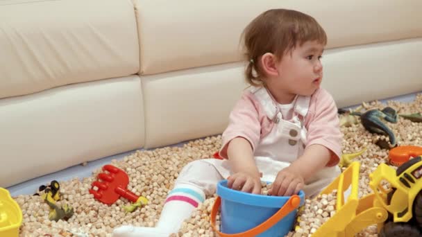 Portrait Year Old Girl Sitting Playing Playroom Staring Something Toddler — Stockvideo