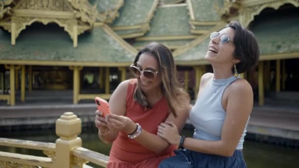 Asian Women Laughing While Looking Smartphone Ancient City Museum Park — Stockvideo