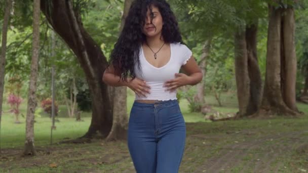 Sexy Curly Hair Latina Jeans Stands Brick Footpath Park Sunny — Video Stock