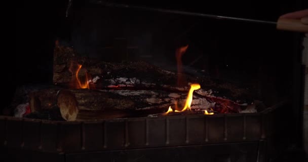 Moving Iron Tongs Wood Chimney While Burns Sparks Fly Slow — Stock videók