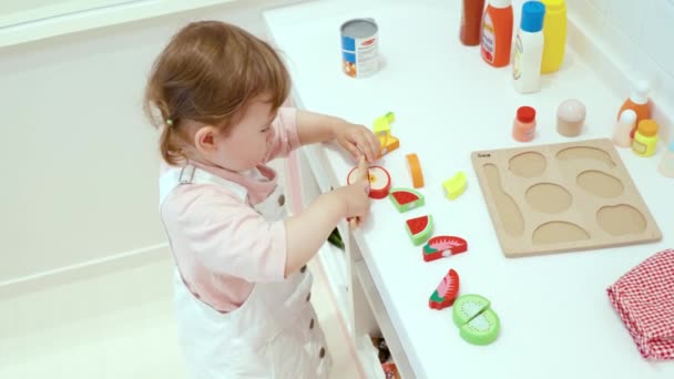 Female Toddler Playing Fruits Cutting Play Toy Set Playroom Child — Stok video