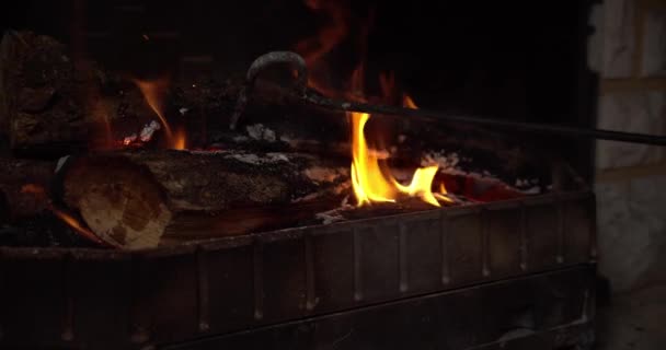 Close Gimbal Shot Hook Arranging Wood Fireplace — Vídeo de Stock