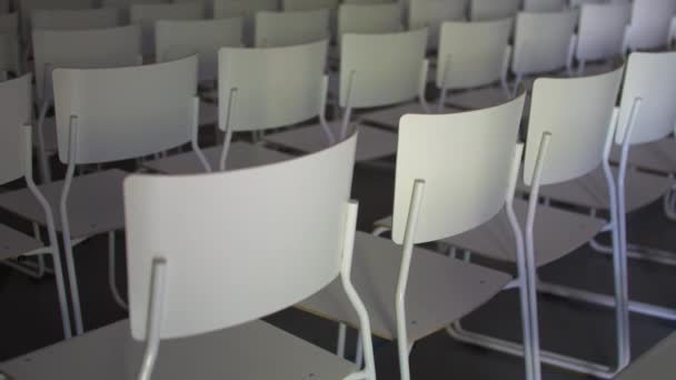 Empty Audience White Chairs Virus Pandemic Lockdown Tilt View — Stock Video