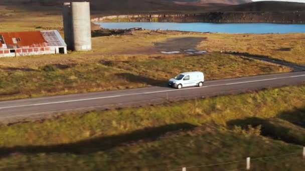 Small White Transporter Van Passing Abandoned Farm Old Silos Golden — Vídeos de Stock