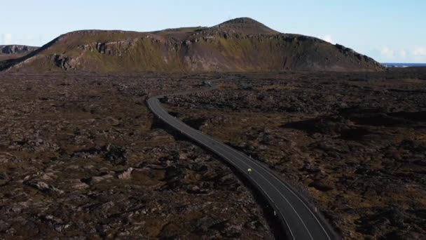 Cyclist Riding Open Road Volcanic Landscape Iceland Mountain Background Aerial — Stockvideo