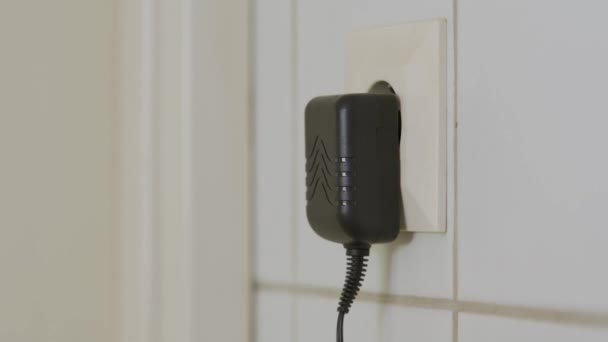 Man Plugging Unplugging Wall Charger Close — Video