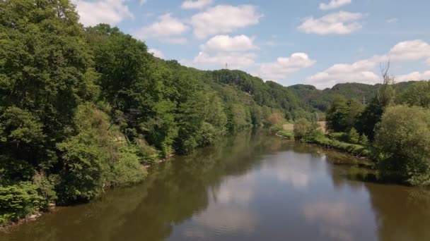 Calm Brown River Surrounded Lush Leafy Riverbanks Blue Sky Cumulus — Stockvideo