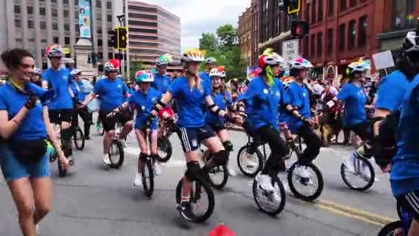 Unicyclists Bright Blue Shirts Celebrate Gay Pride Parade Portland Maine — Stock video