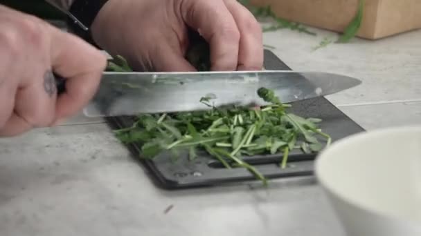 Close Camera Slowly Orbits Chef Chopping Arugula Cutting Board — 비디오