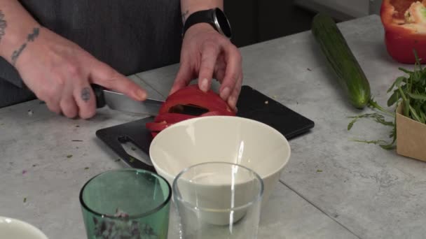 Tattooed Chef Slices Fresh Red Bell Pepper Countertop Cutting Board — Stock Video