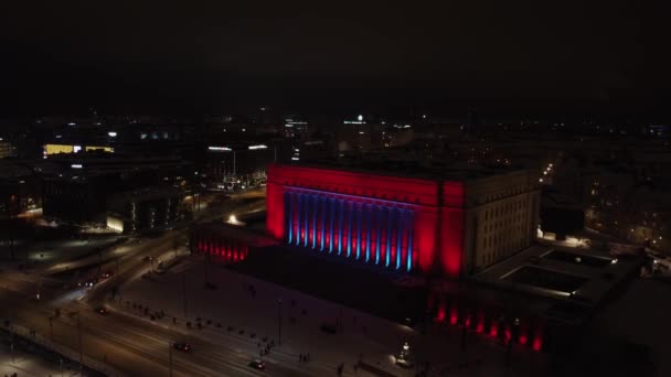 Night Aerial Retreats Helsinki Parliament Lit Blue Red — Stock Video