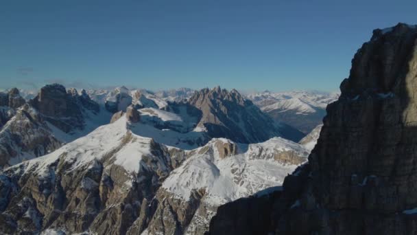 Aerial Pull Back View Snowy Mountain Alps Terrain Reveal Sunlit — Stock Video