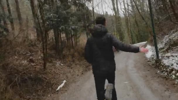 Young Man Short Dark Hair Black Jacket Running Road Woods — Stok video
