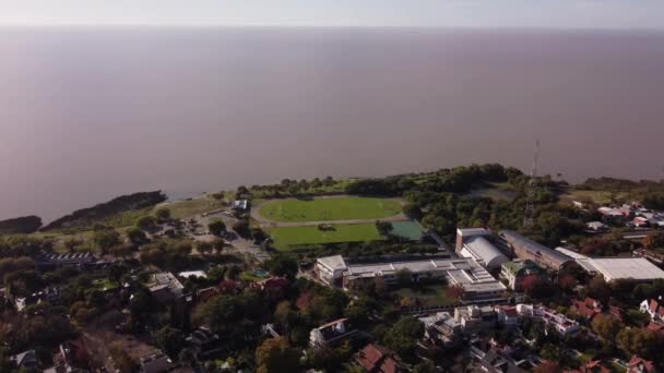 Descending Aerial Shot Soccer Sport Field Front River Sunny Day — Stockvideo