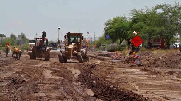 Road Grader Operating Dirt Road Bed Backhoe Workers Traffic Background — 비디오