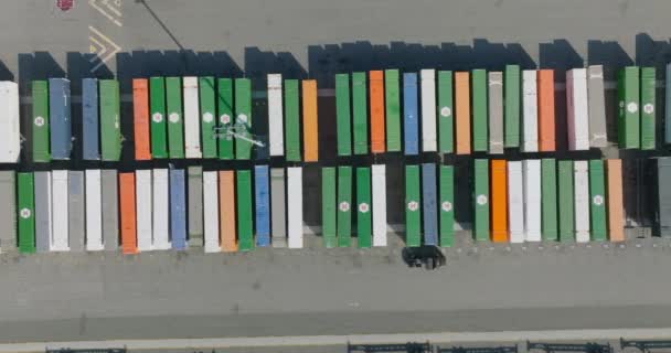 Aerial Drone Shot Scanning Lined Shipping Containers Train Yard Colorful — Stockvideo