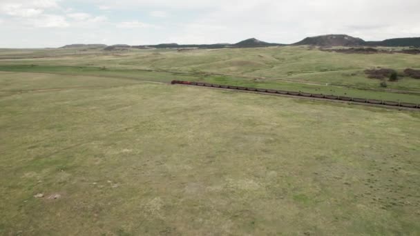 Aerial Approach End Long Coal Train Moving Open Farmland — Stockvideo