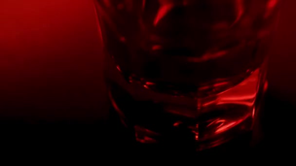 Alcohol Glass Red Blue Police Lights Macro Shot Close View — Vídeo de Stock