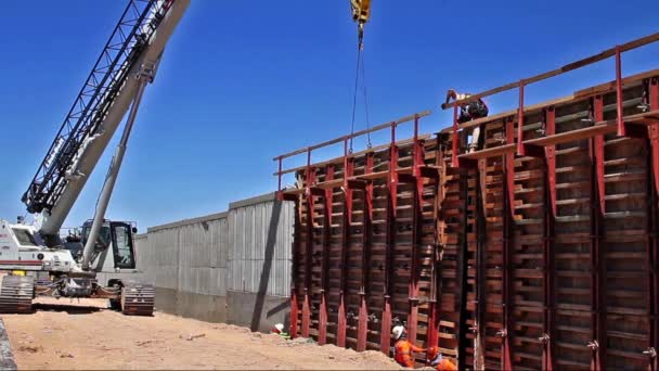 Crane Workers Flying Section Highway Noise Barrier Wall Construction — Video