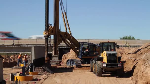 Large Auger Digging Hole Highway Bridge Column Spinning Dirt Traffic — Stok Video