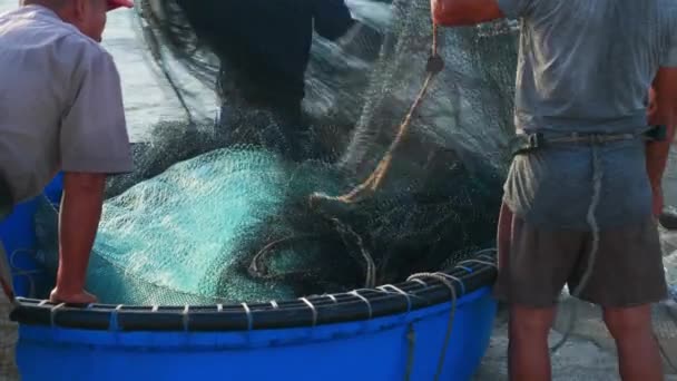 Shot Fishermen Arranging Fishing Net Blue Coracle Boat Heading Out — Video Stock