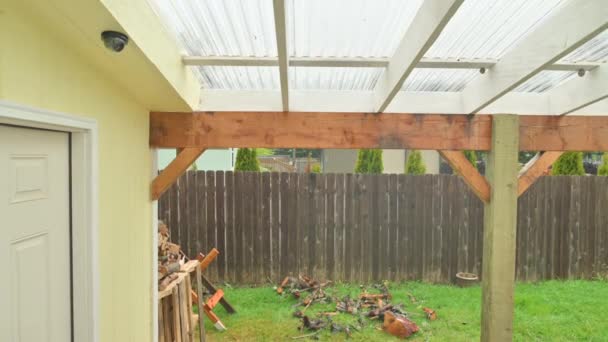 House Awning Fire Wood Wood Beams Fence Background Rainy Day — Stockvideo
