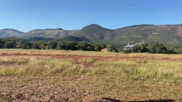 Patrol Helicopter Flies Low Countryside Mountains Daytime — ストック動画