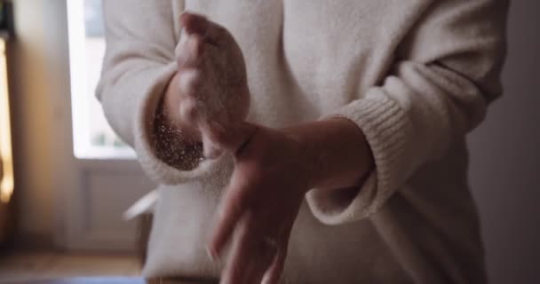 Female Shaking Flour Hands Domestic Kitchen Close View — Video