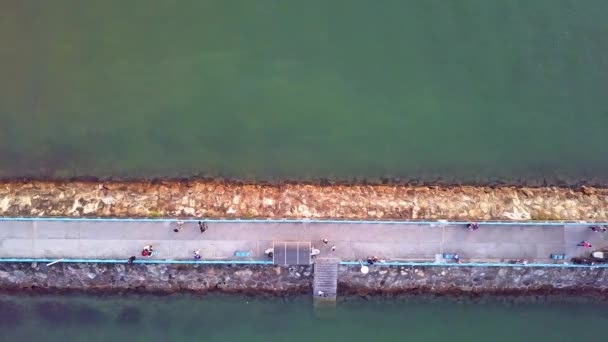 Dynamic Top Aerial Shot Breakwater Jetty Made Out Stones Paved — Stockvideo