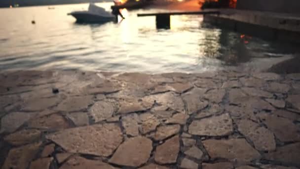 Tilt Reveal Calm Lake Boat Docked Pier Sunset Wide Pov — Stockvideo